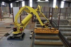 An industrial robot enclosed by fences. Photo credit: Julian Dowse